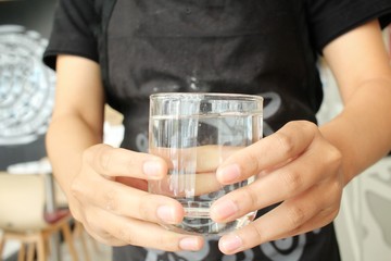 Woman serving water drink
