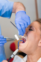 Dentist preparing patient for filling