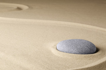Meditation stone in a Japanese zen garden, background concept for purity harmony balance simplicity and relaxation...