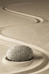Fototapeta na wymiar zen meditation stone and sand, a spiritual japanese rock garden. Abstract harmony and balance concept for purity concentration spa relaxation...