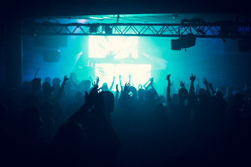 People dance on music in nightclub