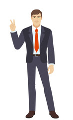 Businessman showing victory sign