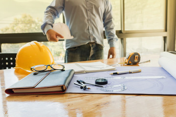 Engineers with Blueprint Construction