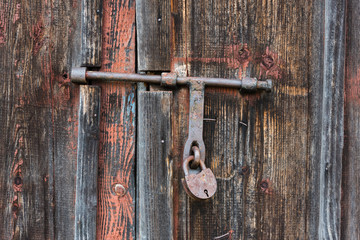 The old door locked with a padlock hanging brackets. Set of backgrounds