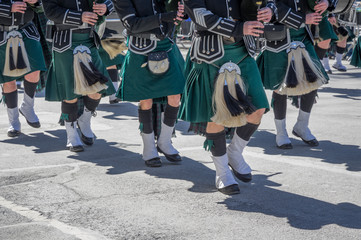 Closeup of green kilts of bagpipes players at 2017 St. Patrick's Day Parade in New York City - 141245180