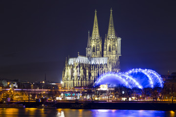 Cologne Cathedral (German: Kolner Dom, officially Hohe Domkirche St. Peter und Maria) across the Rhine, Germany, at dusk