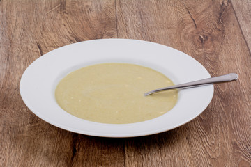 Vegetable soup on a wooden table