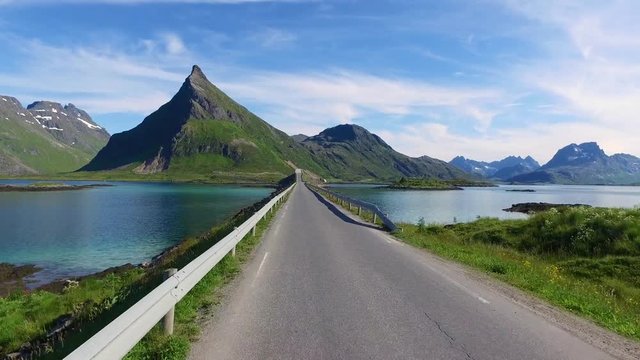 Driving a Car on a Road in Norway Lofoten