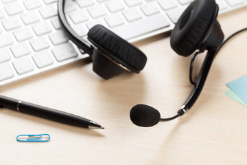 Office desk with headset. Call center support