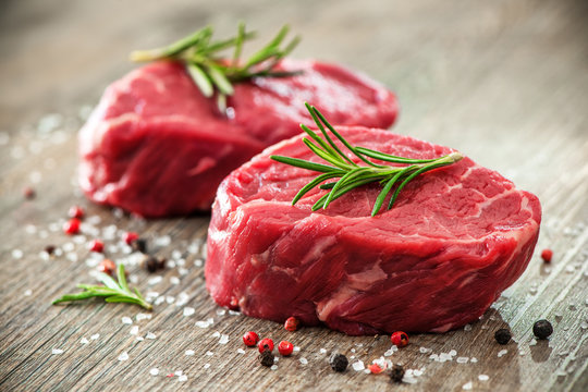 Raw beef fillet steaks with spices