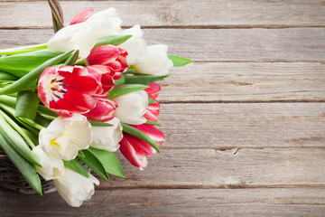 Colorful tulips bouquet basket