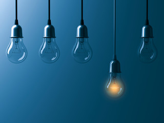 One hanging light bulb glowing different and standing out from unlit incandescent bulbs with reflection on dark cyan background , leadership and different business creative idea concept. 3D rendering.