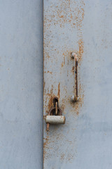 The old door locked with a padlock hanging brackets. Set of backgrounds