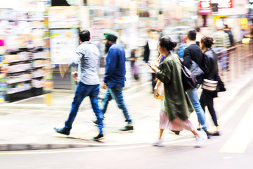 crowd of people crossing a street in Hongkong