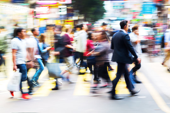 Crowd Of People Crossing A Street In Hongkong