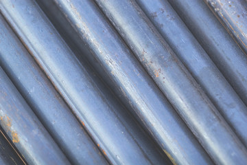 Close up of iron bar that is empty. With thin rusted steel