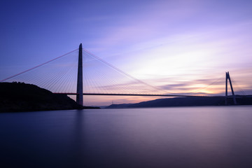 Fototapeta na wymiar New bridge of Istanbul Bosphorus, Yavuz Sultan Selim Bridge with long exposure on sunset