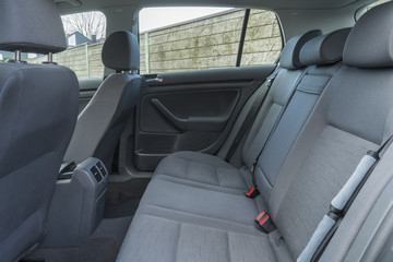 Modern car interior details of rear banch with headrests.