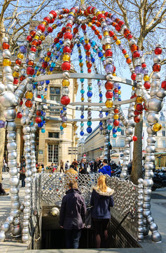 PARIS, FRANCE - APRIL, 2013: Ornate entrance to Palais-Royal (Louvre Museum) metro station, made of colored glass beads, was designed by Jean-Michel Othoniel.