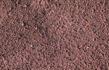 Red earth and gravel macro texture background