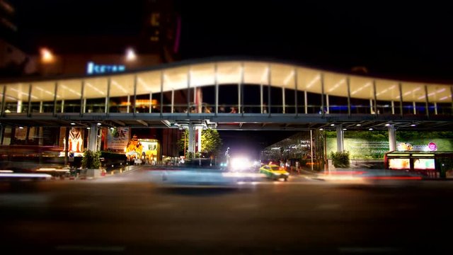 Bangkok, Thailand - January 2, 2017 : Time Lapse miniature traffic at night in front of Central World Shopping Malll. The famous shopping mall at downtown of Bangkok, Thailand