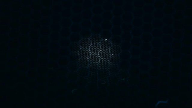 Honeycomb grid pattern with lighting effect over the dark background 4K 3840 x 2160