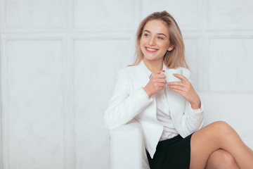 Portrait of beautiful young woman working in the office.