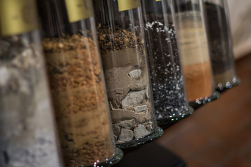 Fragments of soil with glass flasks