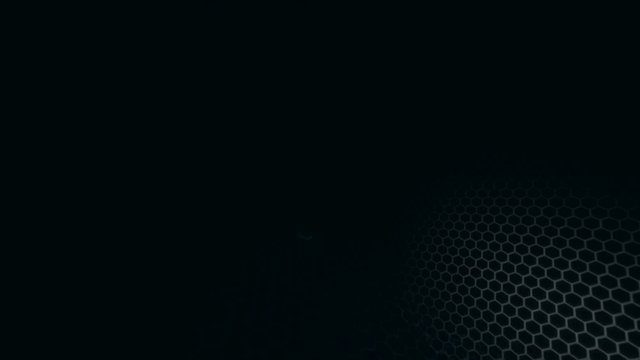 Honeycomb grid pattern with lighting effect over the dark background 4K 3840 x 2160