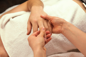 Fototapeta na wymiar Hand massage with white towel