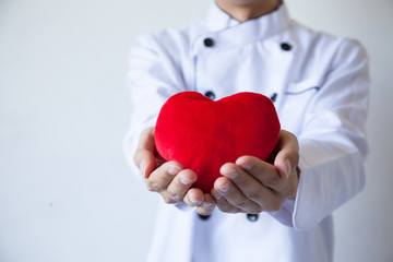 Happy chef holding heart shape with love and passion