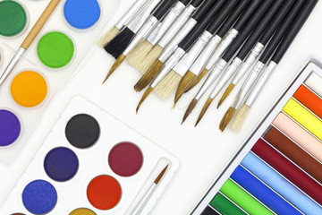 Paint brushes and Paints isolated on white background.