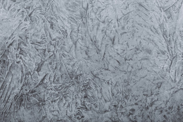 Grey painted canvas with crumpled texture