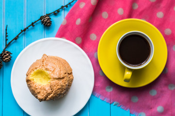 Still life with cup of tea and sweets on the wooden background