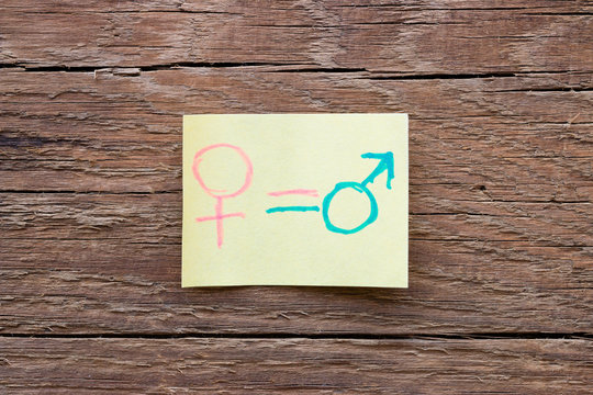 paper notes with gender symbols closeup