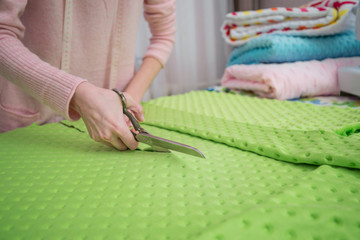 Tailor designer working of cutting piece of cloth