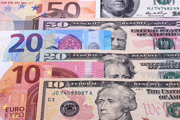 Fototapeta na wymiar Money background american dollars and euro different denominations.