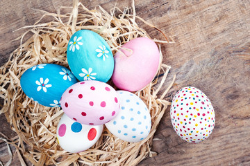 Easter eggs on wooden background  with copyspace. Happy Easter!.