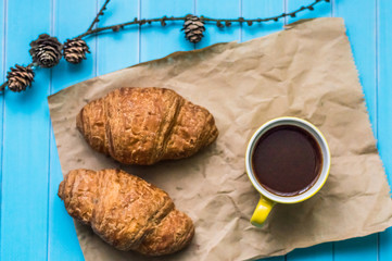 Still life with cup of tea and sweets on the wooden background
