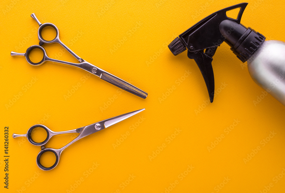 Wall mural hairdresser tools on yellow background top view, barber scissors