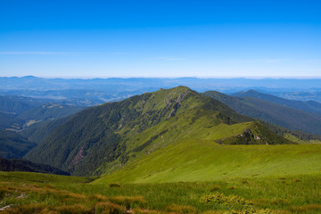 Fototapeta na wymiar Magical panorama of green mountains