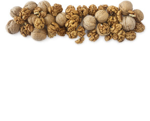 Walnuts background. Walnuts at border of image with copy space for text. Kernels walnuts on a white background. Top view. Vegetarian or healthy eating.