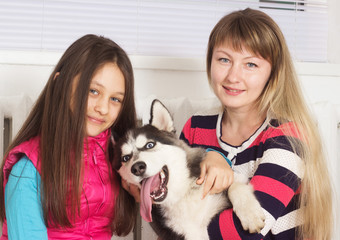 family and Siberian husky dog