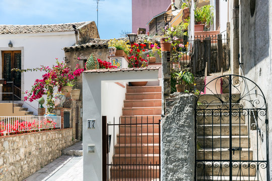 Courtyard with stairs and plants in Taormina at Sicilian Island