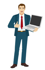 Businessman holding laptop notebook and showing the thumb up