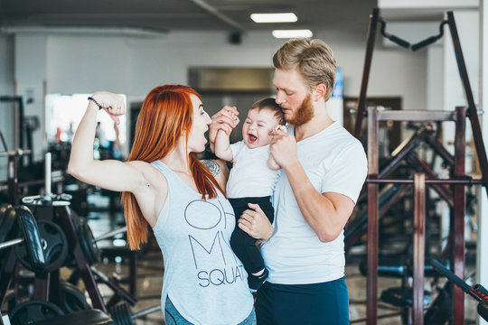 Young Family With Little Boy In The Gym