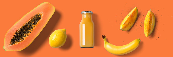 summer fresh drink in glass bottle on orange background - Banner