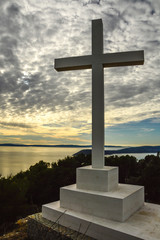 High Concrete crucifix on the top of the mountain above the shore in Split, Croatia