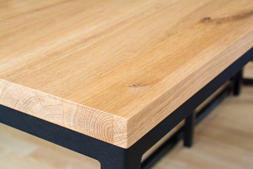 Wooden table top edge and corner.