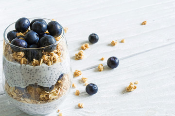 delicious dessert - yogurt with blueberries, granola and chia seeds